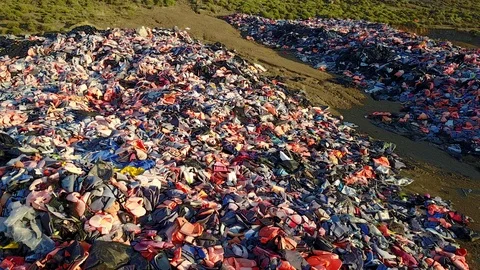 Drone Refugee Lifejackets Dump in Lesbos Stock Footage 86818977