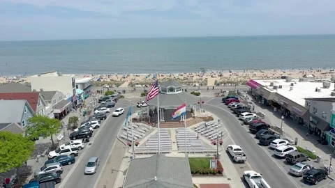 Drone Rehoboth Beach Flags Flying by the Ocean 動画素材 241164871