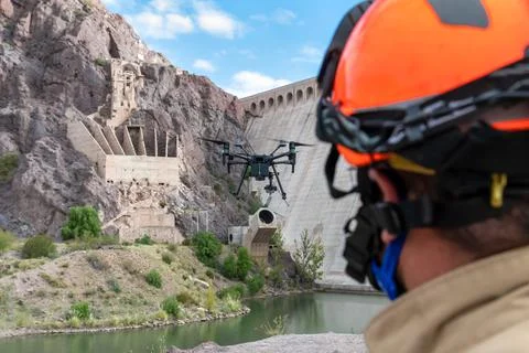 Drone remote control in hand man.Man operating of flying drone Stock Photos