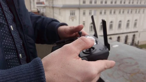 Drone Remote Controller / Hand and remote view of a drone pilot operator. Stock Footage 111681280