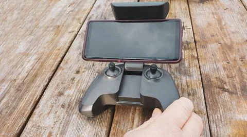 Drone remote controller with phone. Foto stock