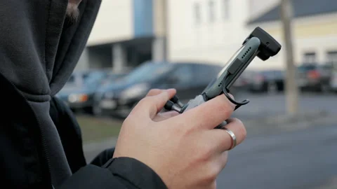 Drone Remote Controlling. Male hands and remote view of a drone pilot operator Stock Footage 170647718