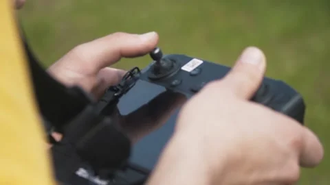 Drone remote manipulating on the farm field Stock Footage 255621017