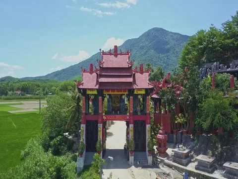 Drone Removes from Pagoda Entrance against Highlands Blue Sky Stock Footage