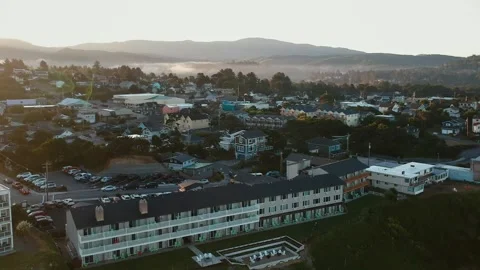 Drone Resort Beach Small Town Aerial Sunrise Fog Hotel Motel Travel Tourism Stock Footage 130600334