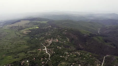 Drone retreating slowly as it flies above Tsarichina Village known for its Stock Footage 263541092