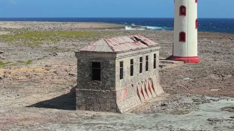 Drone Reveal Of Abandoned Lighthouse Building And Bonaire Lighthouse Stock Footage 337054274