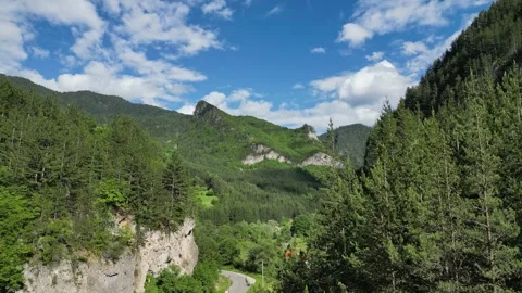 Drone Reveal Entering Trigrad Gorge Above Mountain Road and Pine Forest, Bul Stock Footage 340634271