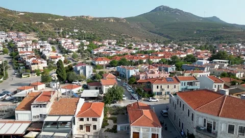 Drone Reveal: Flying Backward Over Coastal Houses Towards Open Aegean Sea Stock Footage 323186035