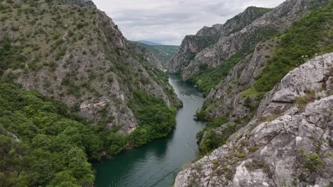 Drone Reveal Flying Over Limestone Cliffs to Show Matka Canyon River, 4K Stock Footage 337175864