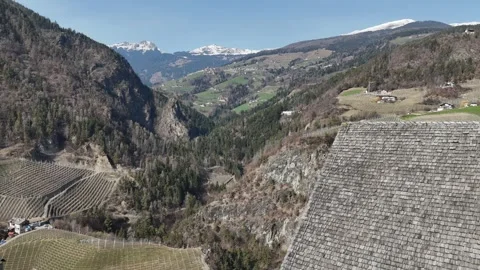 Drone Reveal Inside Cliffside Monastery Chapel with Sunlit Stone Walls a Vídeo Stock 335504104