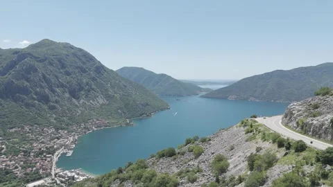Drone Reveal of Risan and Bay of Kotor from Cliffside Road Video stock 310335461