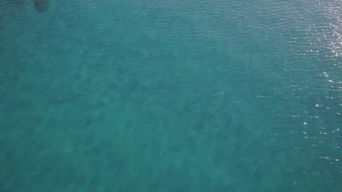 Drone revealing beach over turqoise water Stock Footage 101428645