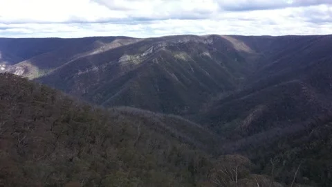 DRONE REVEALING MOUNTAINS Stock Footage 261819646