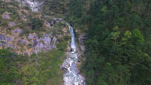 Drone revealing the sheer scale of a massive waterfall in the Himalayan Stock Footage 311389175