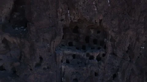 Drone Reveals Ancient Cave on Steep Red Volcanic Mountain Stock Footage 310146471