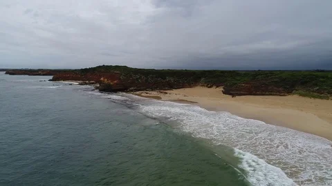 Drone revers shot of waves and cloudy skies bay of islands Stock Footage 84273403