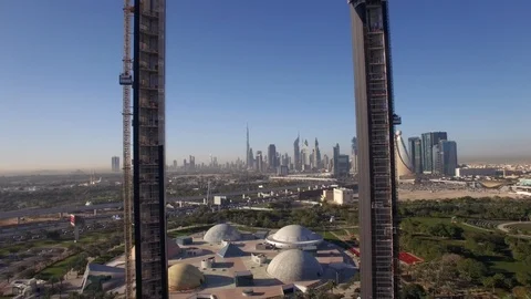 Drone reverse flies through the Dubai Frame under construction Stock Footage 105723376