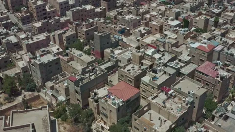 Drone reverse with gimble up shot for a chaotic suburban area in Jordan Stock Footage 297237157