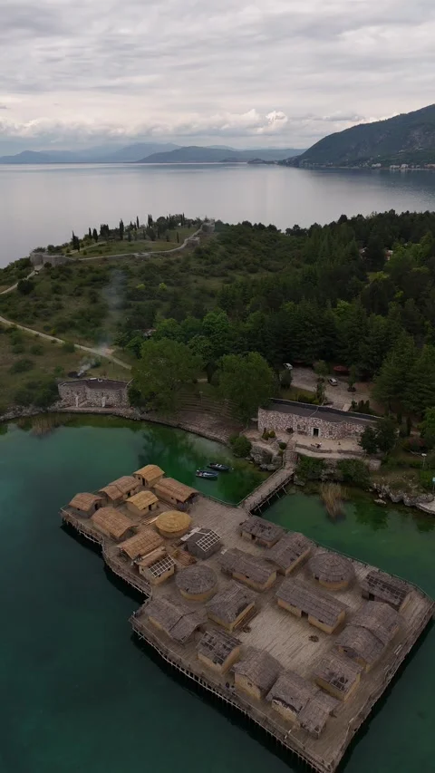 Drone Reverse Parallax of Bay of Bones Stilt Houses on Lake Ohrid, 4K Stock Footage 337177983
