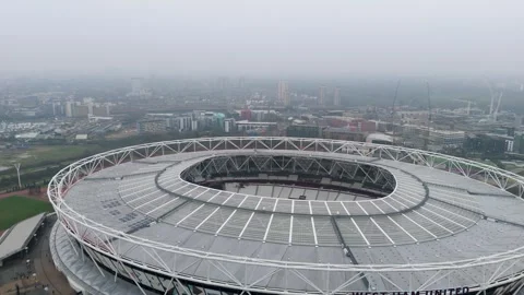 Drone Reverse Revealing West Ham Stadium, Stratford, London, with misty Video stock 311460370