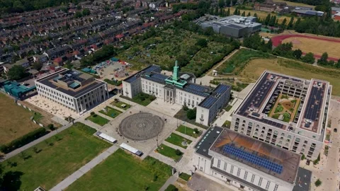 Drone reverse rise over Waltham Forest council offices and Fellowship Square Stock-Footage 340189286