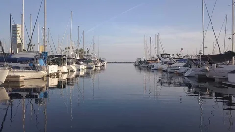 Drone reverse through boats at a dock Stock Footage 96718869