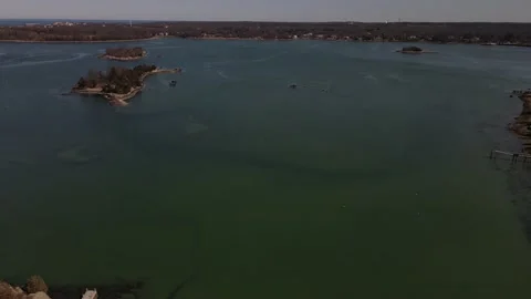 Drone reversing to the edge of the Crow Point Cove, an inlet off of and Stock Footage 151511879
