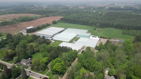 Drone - Right to Left Far View of Greenhouses Property (slow) Stock Footage 314227405
