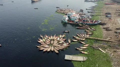 Drone Rise and Tilt Down Over Traditional Boats on Buriganga River in Dhaka Video stock 327221969