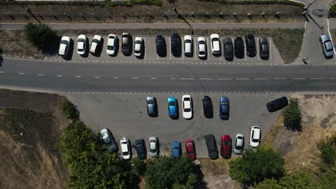 Drone rises above the local parking lot Stock Footage 165595010