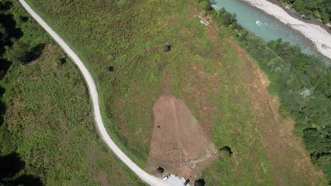 The drone rises above the road, ancient ruins and mountain river Video stock 260793931