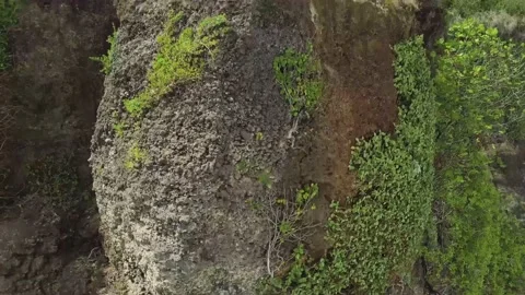 The drone rises along the topography of the mountain. Stock Footage 155987864