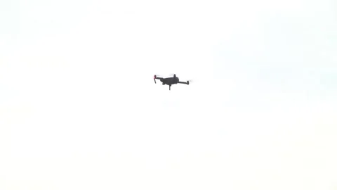 The drone that rises in the clear sky shining from the control lights Stock Footage 145636706