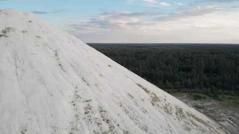 The drone rises higher behind the mountains of waste Stock Footage 170566346
