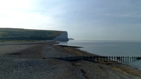 Drone rises over the beach at Cuckmere Haven Stock Footage 92792624