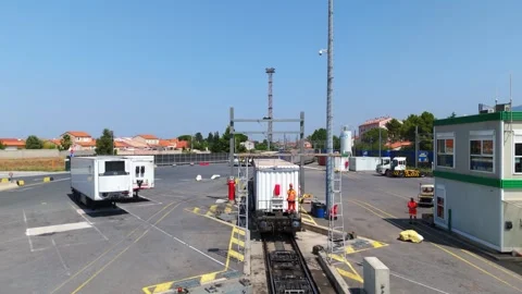 Drone Rises Over Freight Wagon Rolling Through Intermodal Terminal Stock Footage 337231481