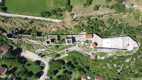 Drone rises over the old city fortress in Niksic, Montenegro Stock Footage 279658312