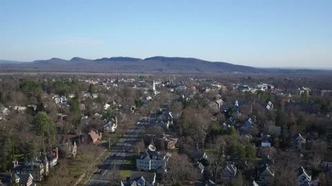 A Drone Rises Slightly Over A Northampton Neighbhorhood Stock Footage 329773753