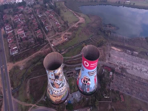 Drone rises slowly and tilts camera down towards Soweto Towers, Johannesburg Stock Footage