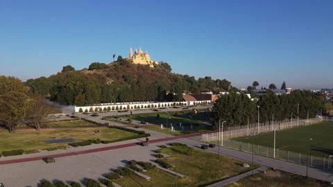 A drone rises slowly over the streets of Mexico's historic city of Cholula Stock Footage 170183016