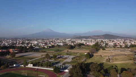 A drone rises slowly over the streets of Mexico's historic city of Cholula Video stock 170183035
