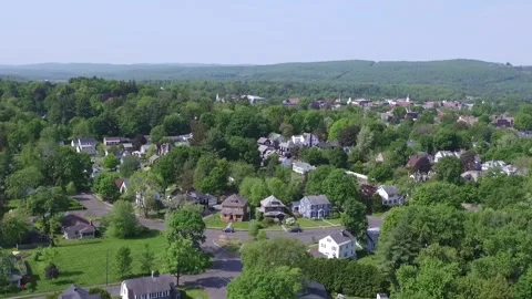 A Drone Rises Then Tilts Down Over A  Neighborhood In Greenfield, Massachusetts. Stock Footage 329773737