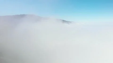 Drone rises up through cloud bank in Big Sur Mountains Stock Footage 142298148