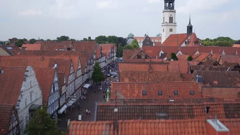 Drone rising up above frame work houses rooftops Stock Footage 87171506