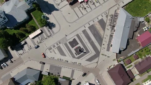 Drone rising above square with rotating motion Stock Footage 331829206