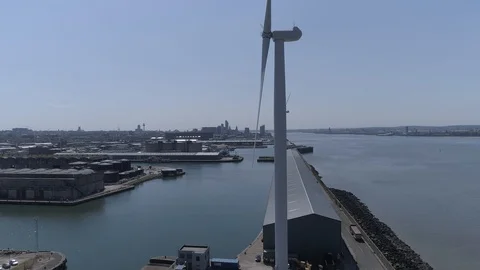 Drone Rising up along side a Wind Turbine - Birkenhead, Mersey, Liverpool Stock Footage 90131515