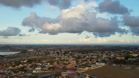 Drone rising and hovering with clouds over residential area Stock Footage 149244732