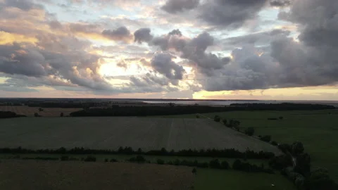Drone Rising to Beautiful Cloudy Sky, Cows, Sea View, Amazing Sunlight Sunset Stock Footage