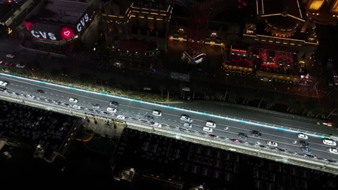 Drone rising in front of the illuminated the Strip and Paris of Las Vegas, night Stock Footage 305616166